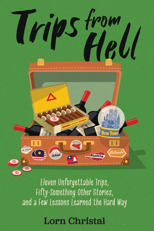 Trips From Hell book cover: an open suitcase stuffed with wine, cigars, casino chips, and a New York snow globe